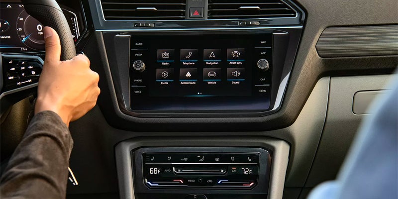 Volkswagen Tiguan infotainment touchscreen and climate controls.